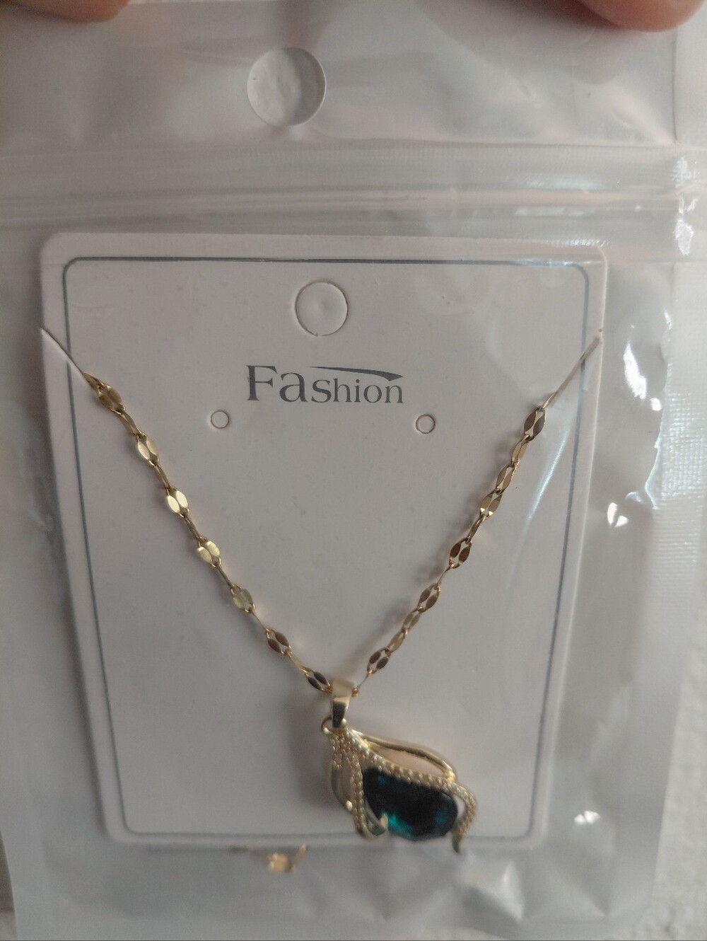 Gold-Tone Necklace with Blue Teardrop Pendant